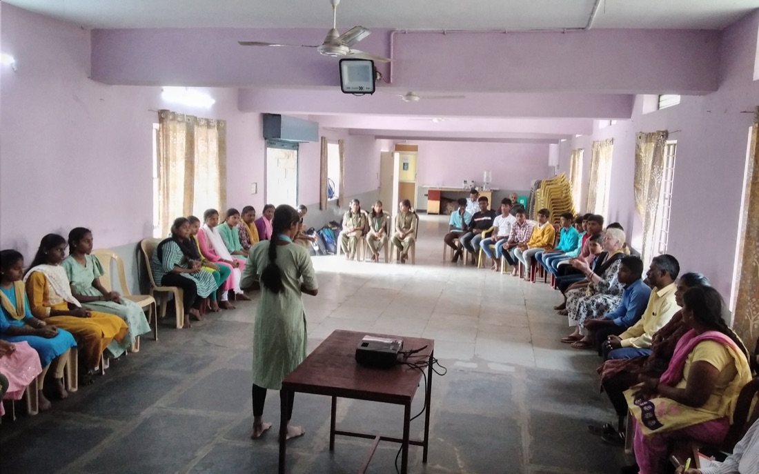 A large group discussion session with youth and adolescents