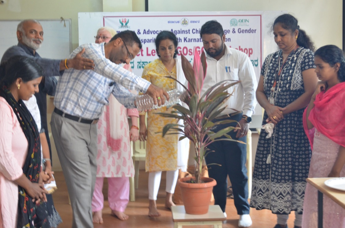Officials at a plantation ceremony marking an NGO/GO workshop
