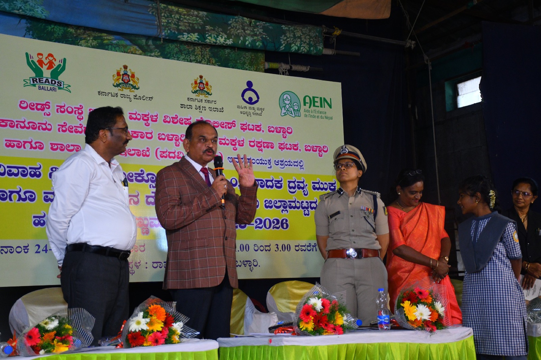 Officials addressing a joint programme with Karnataka Police and the Women and Child Development Department